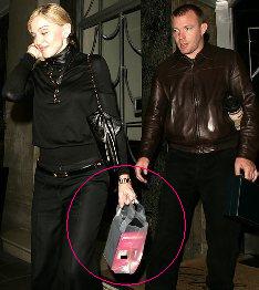 madonna-carrying-strap-on.jpg